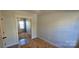 Bedroom with mirrored closet doors and wood-look floors at 153 Saluda St, Chester, SC 29706
