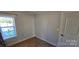 Spacious bedroom with large window and neutral decor at 153 Saluda St, Chester, SC 29706