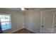 Bright bedroom with window, closet, and wood-look floors at 153 Saluda St, Chester, SC 29706
