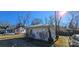 White cottage with a backyard and additional building in view at 153 Saluda St, Chester, SC 29706