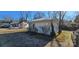 White cottage with a backyard and additional building in view at 153 Saluda St, Chester, SC 29706