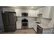 Modern kitchen with stainless steel appliances and granite countertops at 153 Saluda St, Chester, SC 29706