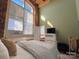 Spacious bedroom with brick wall and large window at 201 S Hoskins Rd # 136, Charlotte, NC 28208