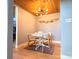 Cozy dining area with wood floors and unique light fixture at 201 S Hoskins Rd # 136, Charlotte, NC 28208