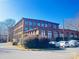 Brick building with ample parking and landscaping at 201 S Hoskins Rd # 136, Charlotte, NC 28208