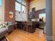 Modern kitchen with dark cabinetry and granite countertops at 201 S Hoskins Rd # 136, Charlotte, NC 28208