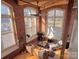 Living room with high ceilings and large windows at 201 S Hoskins Rd # 136, Charlotte, NC 28208