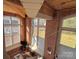 High-ceilinged living room with hardwood floors and brick walls at 201 S Hoskins Rd # 136, Charlotte, NC 28208