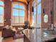 Living Room features hardwood floors, exposed brick, and abundant natural light at 201 S Hoskins Rd # 136, Charlotte, NC 28208
