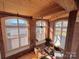 Spacious loft living area with exposed brick and large windows at 201 S Hoskins Rd # 136, Charlotte, NC 28208