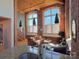 Open living area with hardwood floors, exposed brick and large windows at 201 S Hoskins Rd # 136, Charlotte, NC 28208