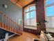 Living room with hardwood floors, exposed brick, and staircase at 201 S Hoskins Rd # 136, Charlotte, NC 28208