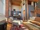 Living area features exposed brick and wood beams at 201 S Hoskins Rd # 136, Charlotte, NC 28208