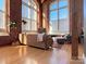 Spacious living room with exposed brick and large windows at 201 S Hoskins Rd # 136, Charlotte, NC 28208