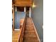 Wooden staircase leading to upper level at 201 S Hoskins Rd # 136, Charlotte, NC 28208