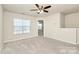 Bedroom with ceiling fan and access to loft at 239 Anvil Draw Pl, Rock Hill, SC 29730