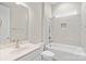 Well-lit bathroom featuring modern fixtures, tile surround tub, and elegant countertop at 253 Stone Mountain Way, Denver, NC 28037