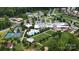 Aerial view of a community center with a pool, tennis courts, clubhouse, and well-manicured landscaping at 253 Stone Mountain Way, Denver, NC 28037