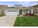Charming single-story home with a well-manicured lawn and attractive landscaping at 253 Stone Mountain Way, Denver, NC 28037