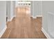 Hallway featuring natural hardwood floors, white baseboards and neutral wall paint at 253 Stone Mountain Way, Denver, NC 28037