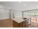 Kitchen island with countertop, sink, and cabinetry in a bright, open space at 253 Stone Mountain Way, Denver, NC 28037