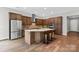 A modern kitchen featuring stainless steel appliances, an island, and stylish cabinetry at 253 Stone Mountain Way, Denver, NC 28037
