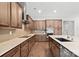 Beautiful kitchen featuring stainless steel appliances, custom cabinets, and hardwood flooring at 253 Stone Mountain Way, Denver, NC 28037