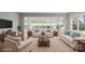 Staged living room featuring neutral furniture, hardwood floors, and lots of natural light at 253 Stone Mountain Way, Denver, NC 28037