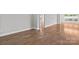 Spacious living room with hardwood floors and neutral paint, perfect for entertaining guests or relaxing at 253 Stone Mountain Way, Denver, NC 28037
