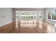 Empty living room with large windows overlooking the backyard, ready for personalization at 253 Stone Mountain Way, Denver, NC 28037