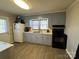 Cozy kitchen with light gray cabinets and black appliances at 2805 N Main St, Kannapolis, NC 28081