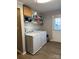 Functional laundry room with washer, dryer, and extra storage at 2805 N Main St, Kannapolis, NC 28081