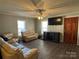 Bright living room featuring light beige couches and a large TV at 2805 N Main St, Kannapolis, NC 28081