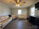Bright living room featuring light beige couches and a large TV at 2805 N Main St, Kannapolis, NC 28081