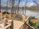 Scenic deck view showcasing a bench with lake access at 3115 Duck Point Dr, Monroe, NC 28110