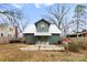 View of backyard featuring a patio area, garden beds, and a well-maintained lawn at 3317 Ritch Ave, Charlotte, NC 28206