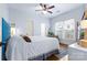 Cozy bedroom with hardwood floors, a ceiling fan, and large window for natural light at 3317 Ritch Ave, Charlotte, NC 28206