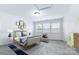 Bright bedroom features a decorative rug, matching side tables and ample natural light at 3317 Ritch Ave, Charlotte, NC 28206