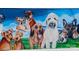 A captivating mural of various dog breeds painted on an exterior wall at 3317 Ritch Ave, Charlotte, NC 28206