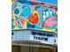 Neighborhood Theatre with a painted mural facade featuring colorful characters at 3317 Ritch Ave, Charlotte, NC 28206