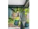 Inviting covered porch featuring a hanging chair, potted plants, and a relaxing outdoor space at 3317 Ritch Ave, Charlotte, NC 28206