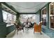 Cozy covered front porch with comfortable seating, brick accents, and decorative lighting for relaxing evenings at 3317 Ritch Ave, Charlotte, NC 28206