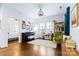 Bright living room with hardwood floors, large windows, and a stylish piano creating a warm and inviting atmosphere at 3317 Ritch Ave, Charlotte, NC 28206