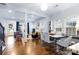 Open concept design featuring a living room with a fireplace adjacent to the dining area and hardwood floors at 3317 Ritch Ave, Charlotte, NC 28206