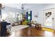 Inviting living room with hardwood floors, bookshelves, a piano and lots of natural light at 3317 Ritch Ave, Charlotte, NC 28206