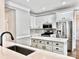 Modern kitchen featuring white cabinets, stainless steel appliances, and a large island at 3512 Conway Ct, Fort Mill, SC 29715