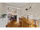 Light-filled dining room with hardwood floors and view of living room at 6440 Kathyrn Ct, Belmont, NC 28012