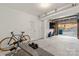 Garage interior with bicycle and weight bench at 6440 Kathyrn Ct, Belmont, NC 28012