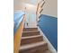 Stylish carpeted staircase with blue accent wall at 6440 Kathyrn Ct, Belmont, NC 28012