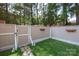 Small backyard with stone pathway and wooden fence at 6818 Copernicus Cir, Charlotte, NC 28226